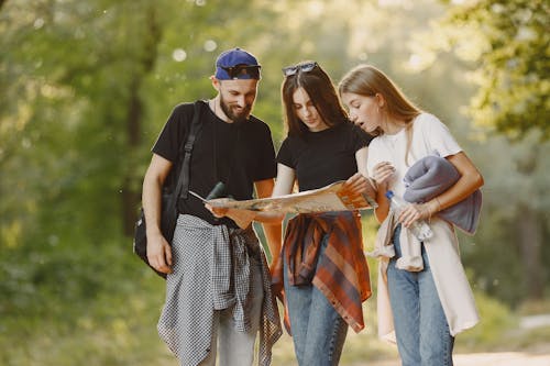 A Group of Friends Looking at the Map