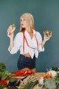 Woman Wearing a Tape-measure Over Her Neck and Holding Healthy Food