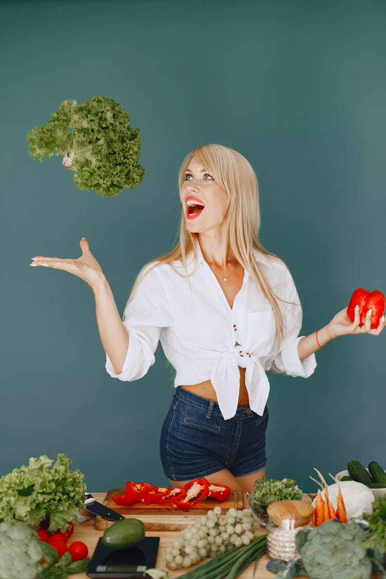 Happy Woman Tossing Vegetables 