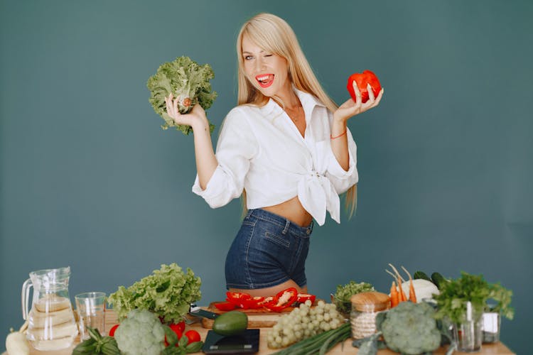 Blond Woman Posing With Vegetables