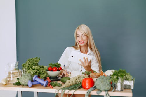 Woman Posing with Food on Table