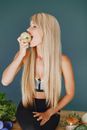Woman in Sports Clothing Eating an Apple 