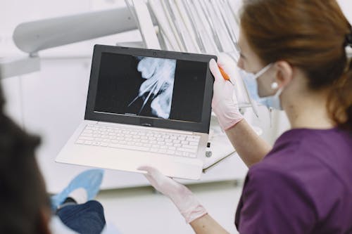 Free Dentist Explaining the X-ray Result Stock Photo