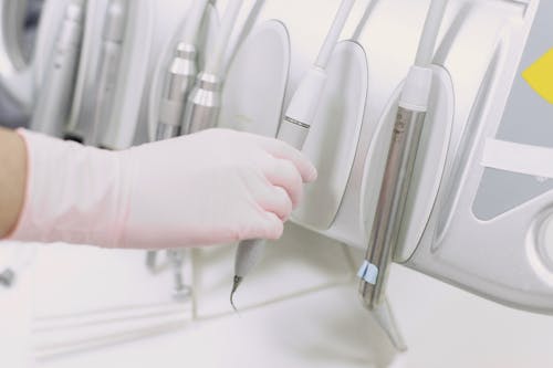 Free Close-Up Shot of Person Getting Sterile Dental Equipment Stock Photo