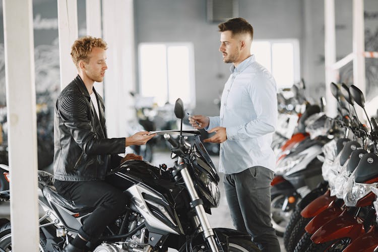 Customer Talking To The Motor Vehicle Dealer