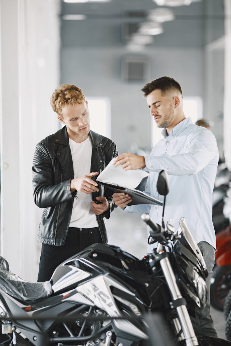 Customer Talking To The Motor Vehicle Dealer