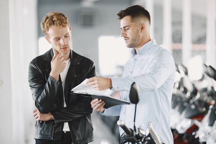 Customer Talking To The Motor Vehicle Dealer