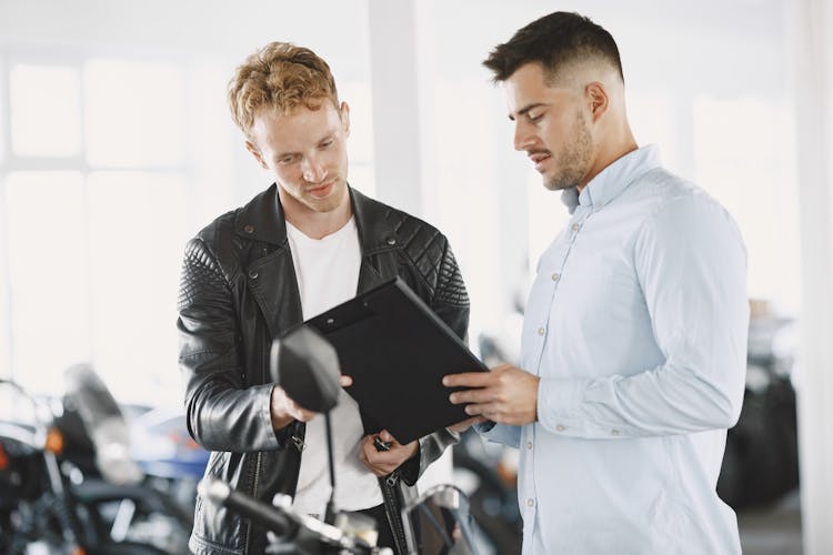 Customer Talking To The Motor Vehicle Dealer