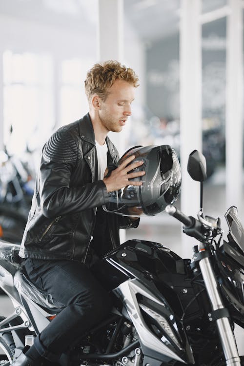 Man in Black Leather Jacket Riding Motorcycle · Free Stock Photo