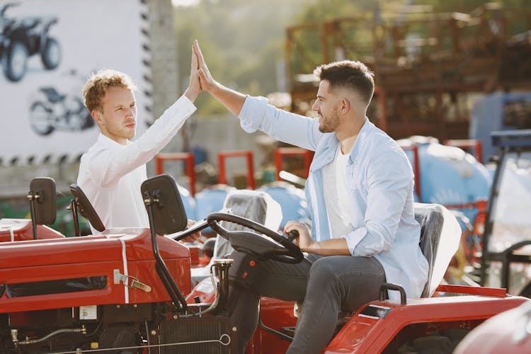 Customer Doing High Five With The Salesman