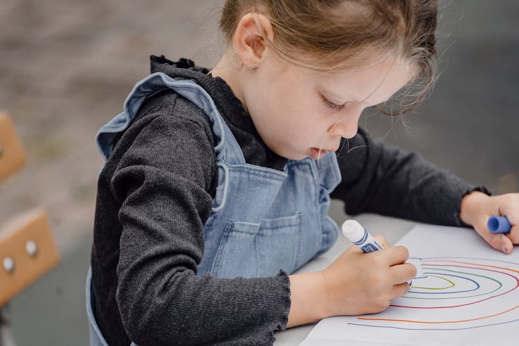 Focused Little Girl Painting Colorful Picture