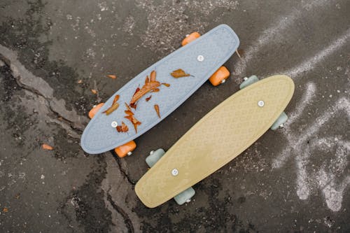 Colorful skateboards on asphalt surface