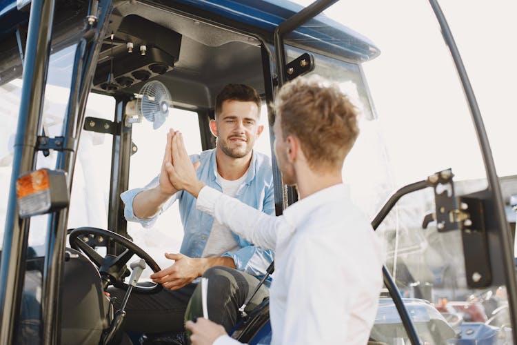 Customer Doing High Five With The Salesman