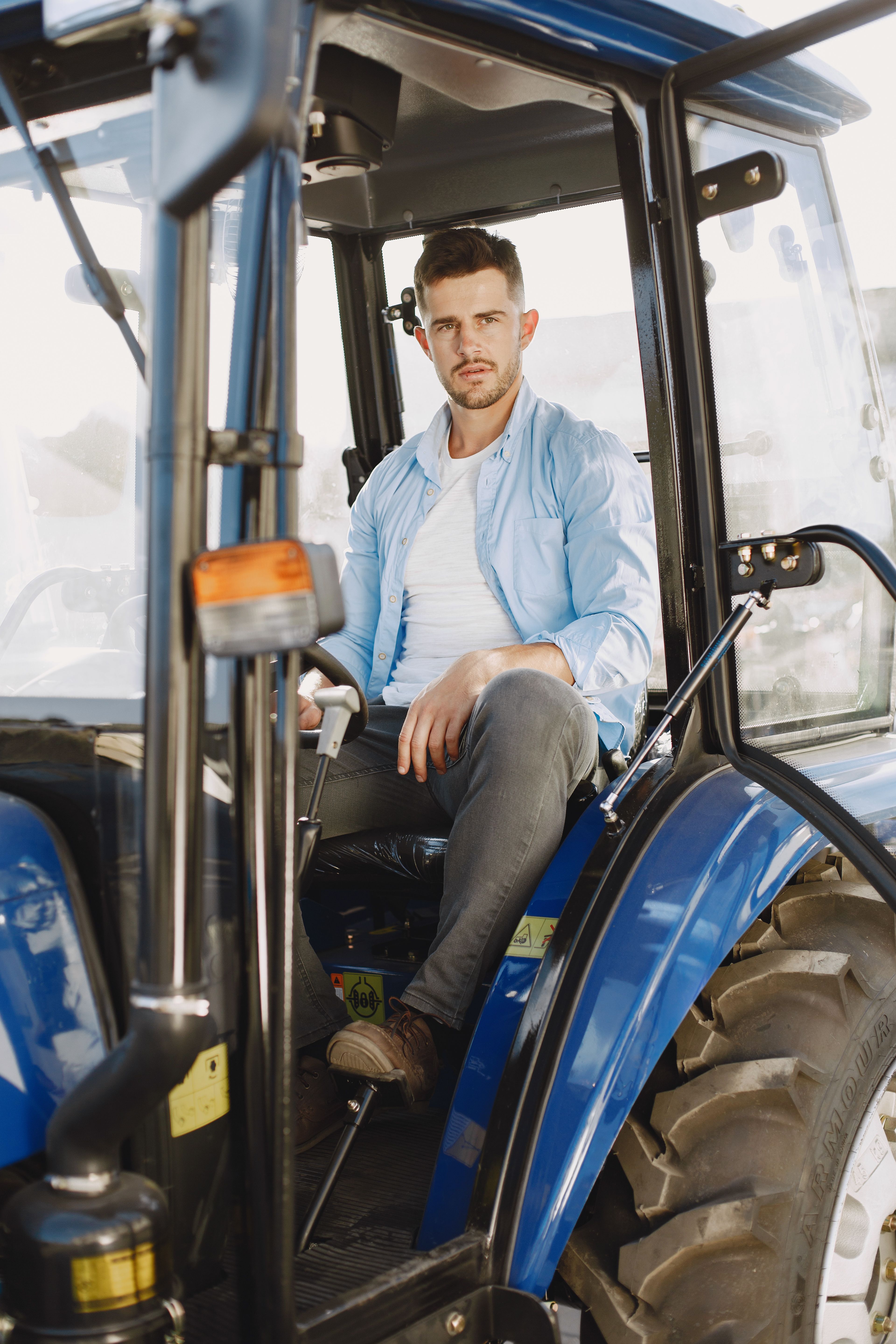 Men Riding a Tractor · Free Stock Photo