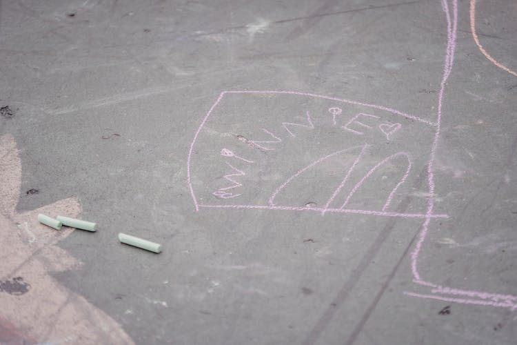 Pink Chalk Drawing On Asphalt Road