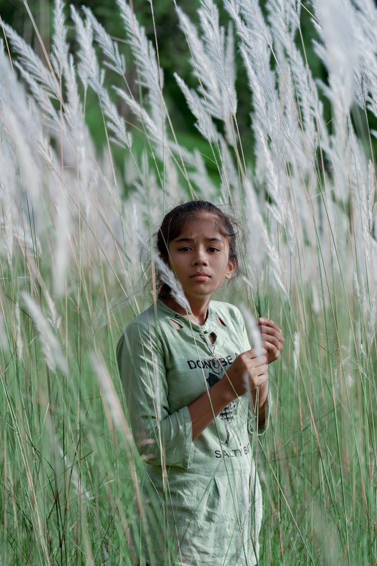 Girl Surrounded By Wild Sugarcane Grass