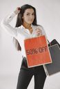 Woman in White Long Sleeve Shirt Holding Red and White Love Print Tote Bag
