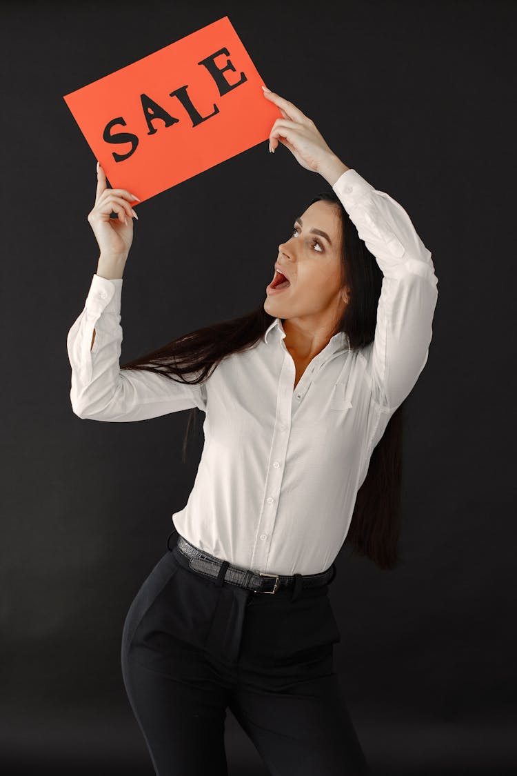 Woman With Sale Banner On Black Background