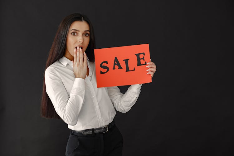 Woman With Sale On Paper Sheet