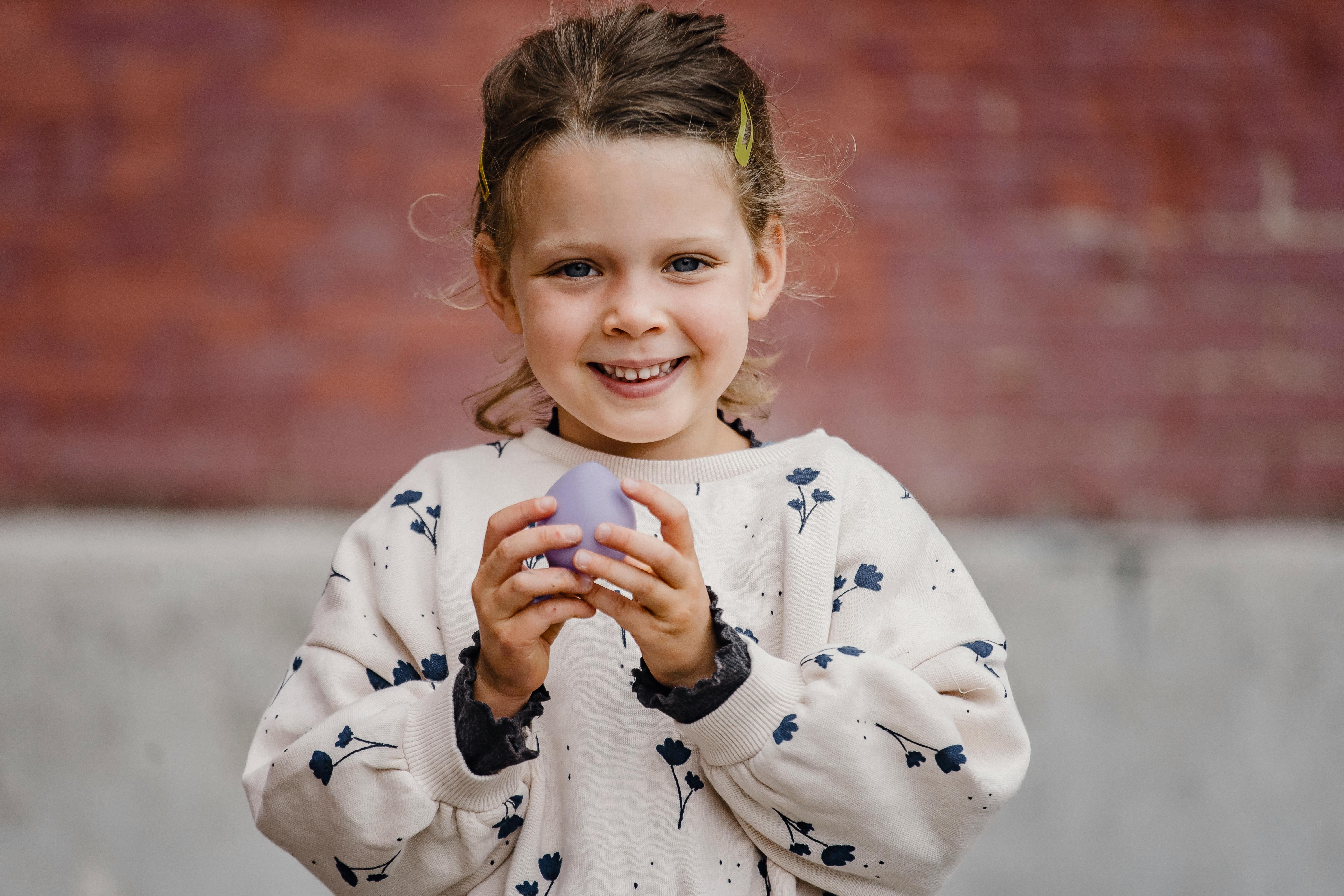 happy girl with balloon on street