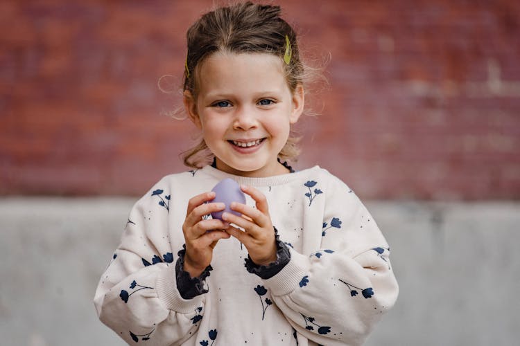 Happy Girl With Balloon On Street