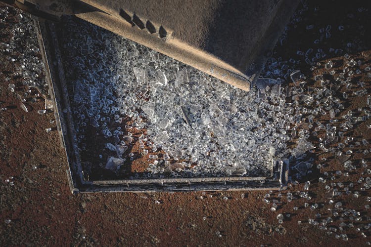 Broken Glass Peaces Scattered On Ground