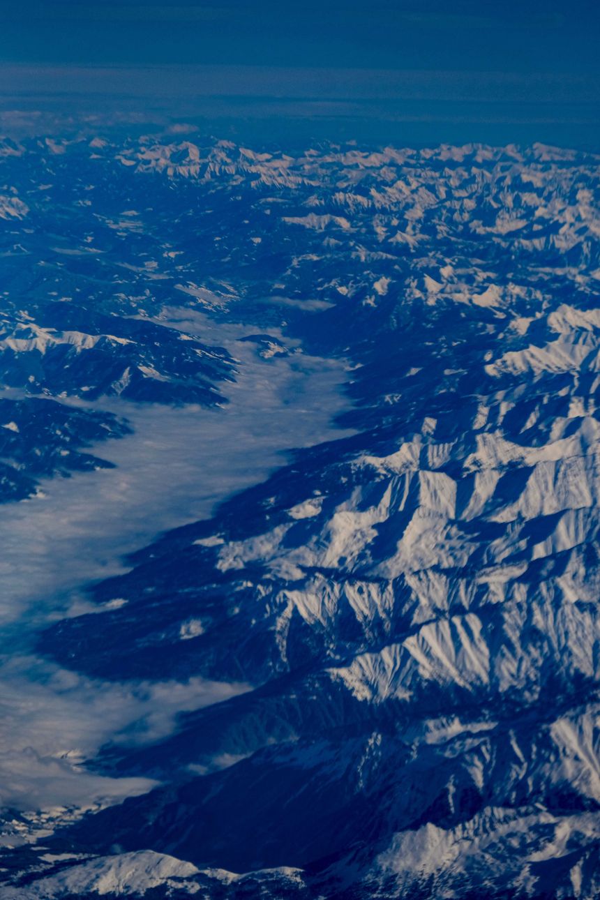 Aerial view of a snow-covered mountain range by Francesco Ungaro on Pexels