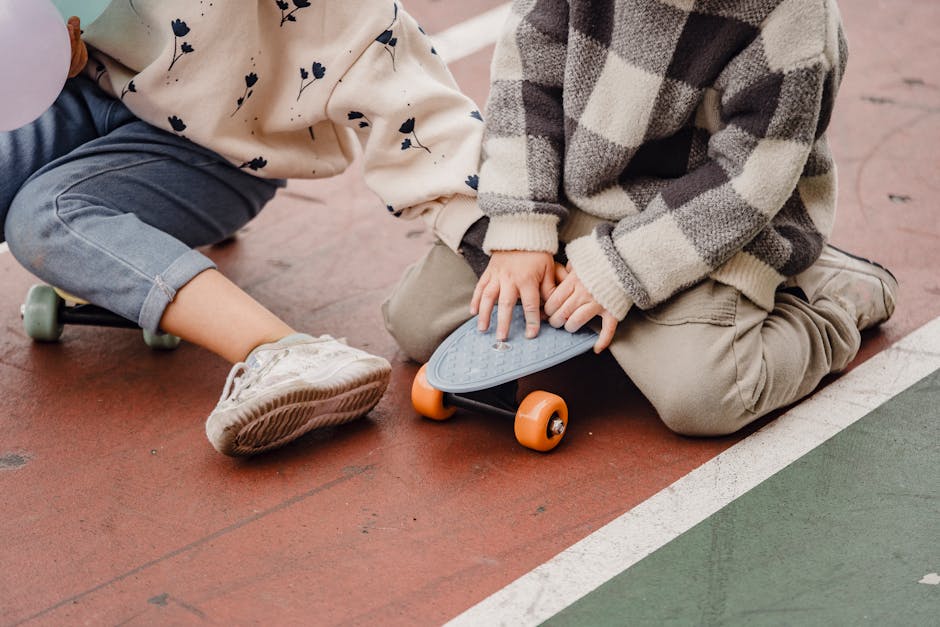 What Safety Research Reveals About Crib Mattress Fit Crop faceless children in casual clothes sitting on skateboards on asphalt road in daytime