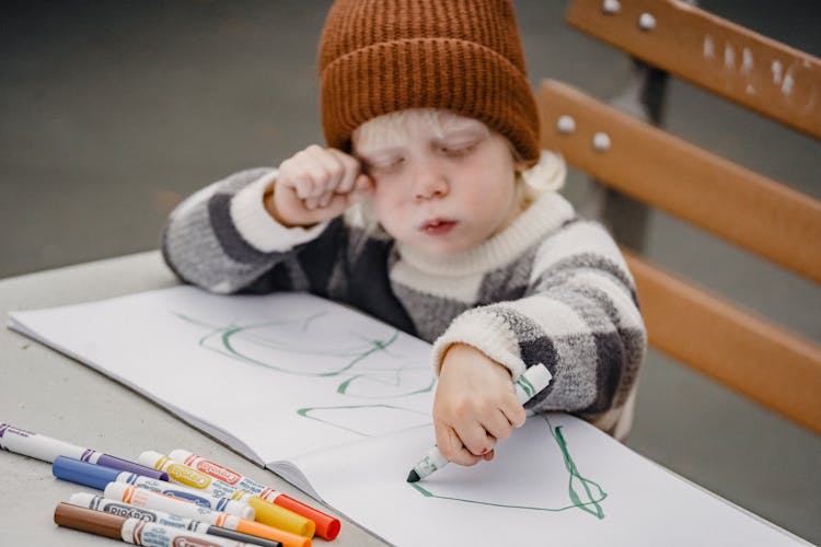 Little Boy Drawing On Street