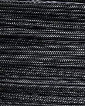 Close-up view of neatly stacked metal rebars showcasing detailed texture and industrial feel.