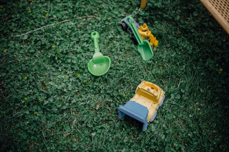 Colourful Plastic Toys In Garden