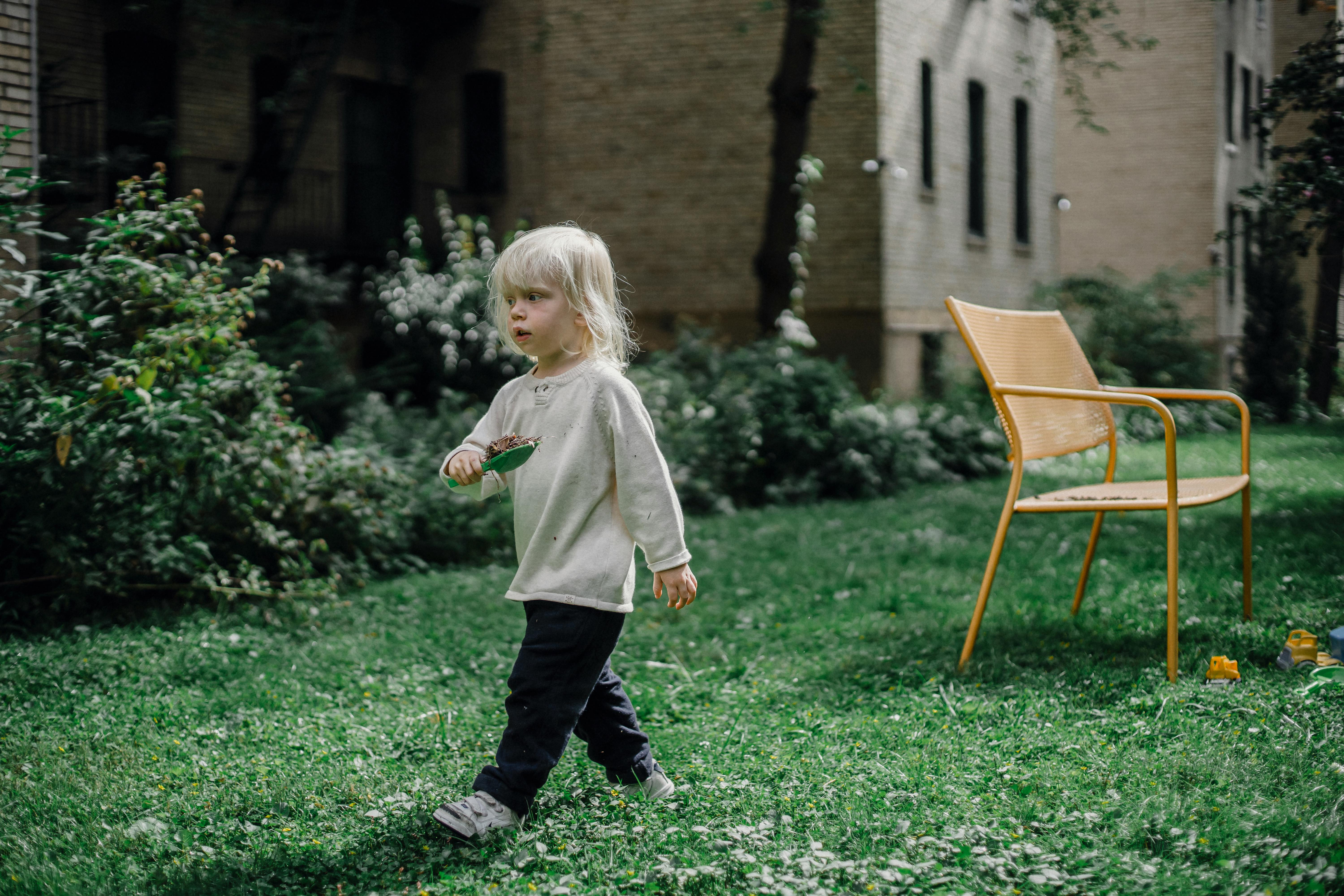 little child playing in garden