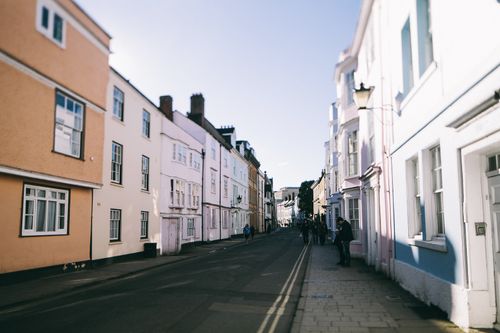 Free Explore the vibrant street in Oxford with classic British architecture bathed in sunlight. Stock Photo