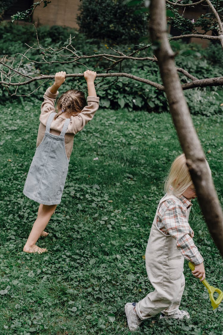 Little Cute Children Playing And Running In Yard