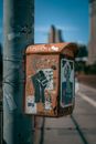 Metal box hanging on pole
