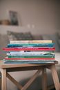 Stack of Books on Brown Wooden Table