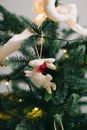 White and Red Snowman Ornament on Green Christmas Tree