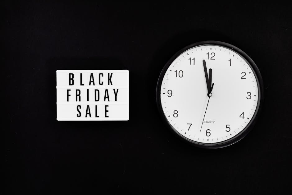 A Black Friday Sale Signage Beside a Black and White Round Analog Wall Clock