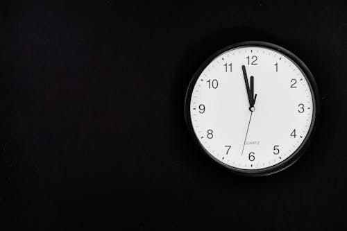 Free Black Round Analog Wall Clock On Black Background Stock Photo