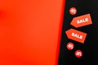 A Red Sale Tags on Red and Black Background