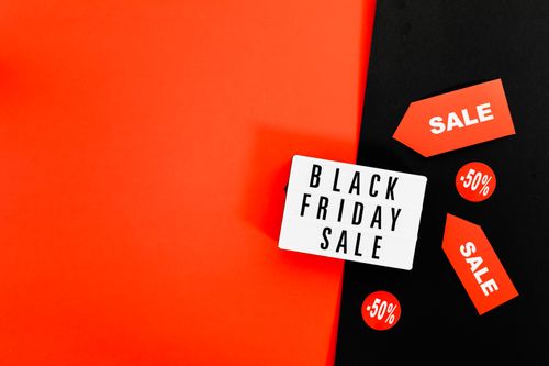 Free Colorful Black Friday sale background featuring promotional tags. Stock Photo