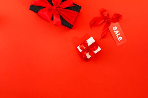 Black And White Gift Boxes On Red Surface