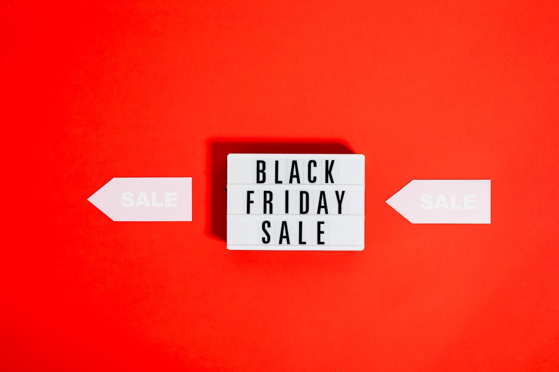 Free Black Friday Sale Sign On Red Background Stock Photo