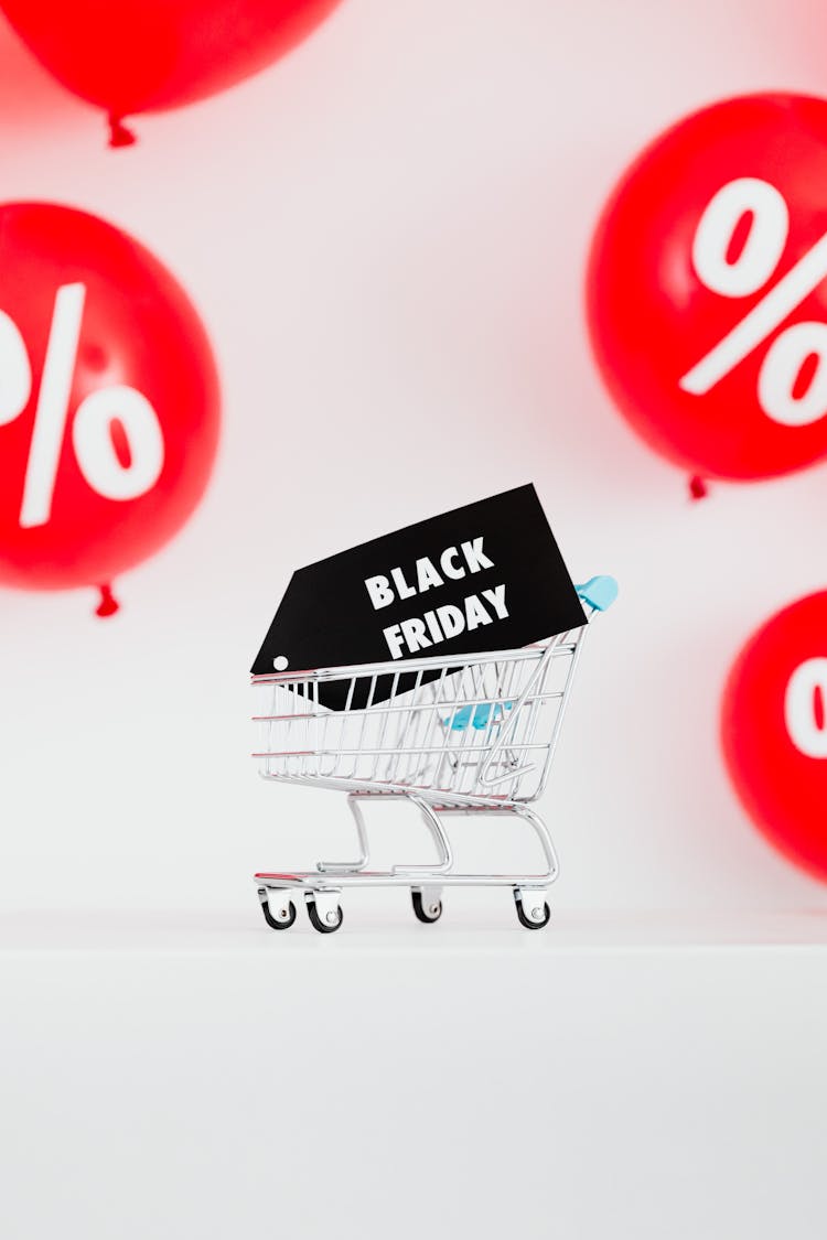 A Black Friday Sale Signage In A Miniature Shopping Cart