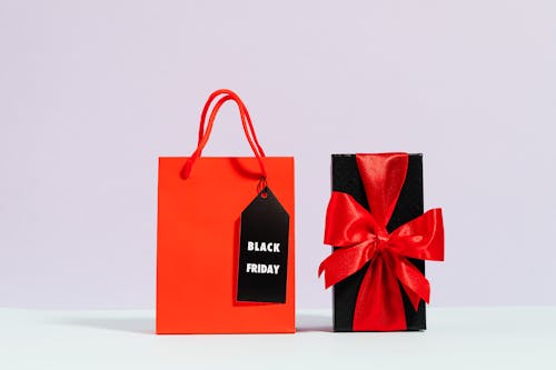 Red Paper Bag Beside A Present