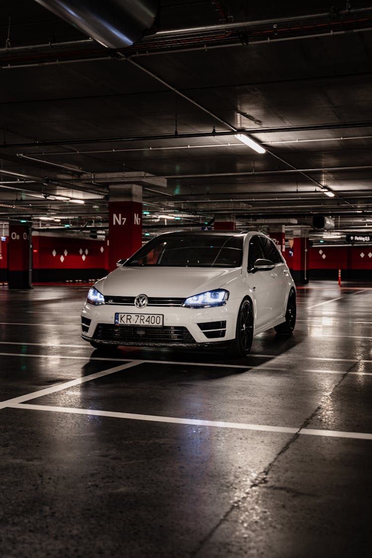 White Car Parked In The Parking Lot