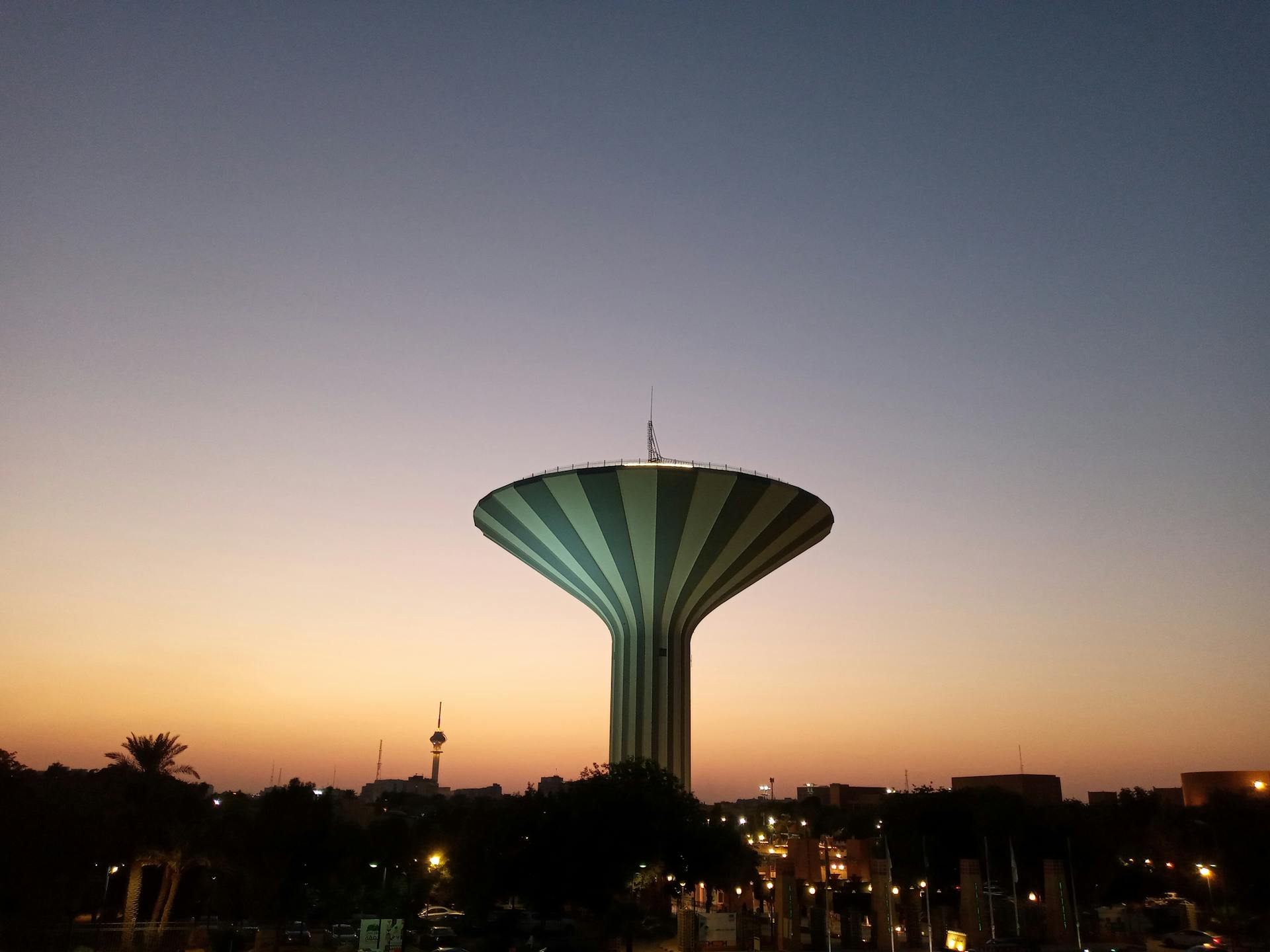 Beautiful view of Riyadh Water Tower silhouetted against a stunning sunset sky.