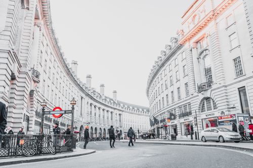 Free Iconic Regent Street in London with people walking and classic architecture. Stock Photo