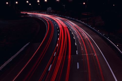 Free Long exposure shot of vibrant light trails on a highway in Toronto at night. Stock Photo