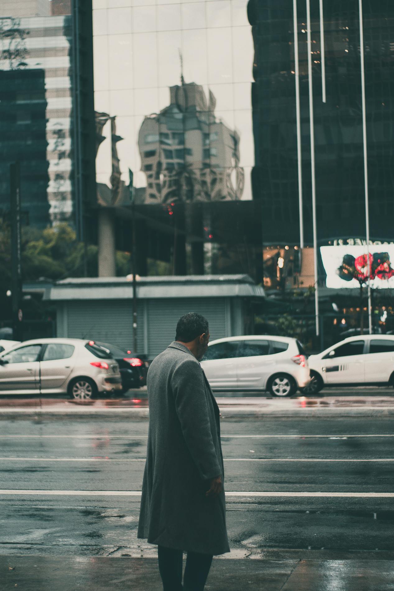 Man Wearing Black Coat Standing on Sidewalk · Free Stock Photo
